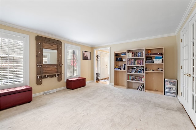 interior space featuring crown molding and carpet