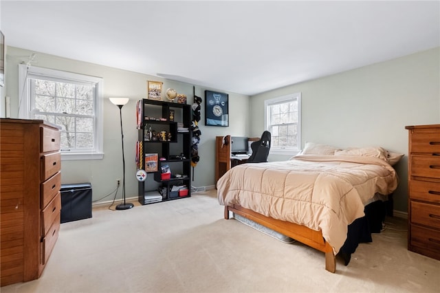 bedroom featuring light colored carpet