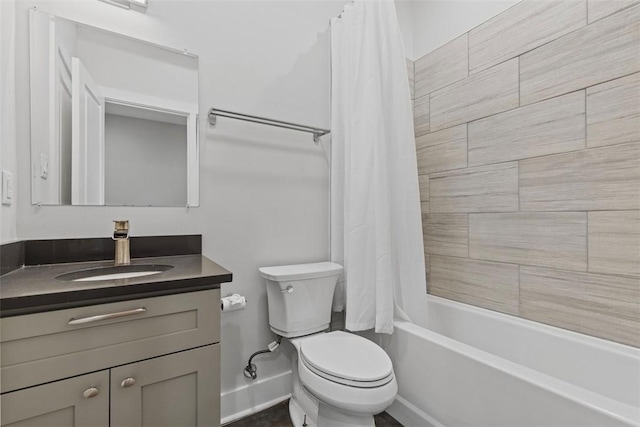 full bathroom featuring vanity, shower / tub combo, and toilet