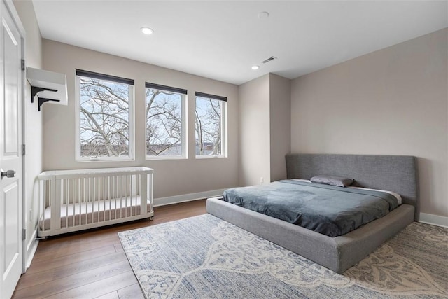 bedroom with wood-type flooring