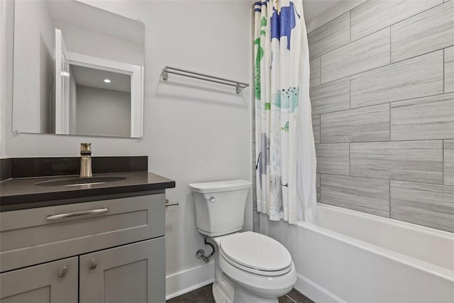 full bathroom featuring shower / tub combo with curtain, vanity, and toilet