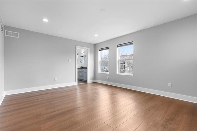 spare room featuring dark hardwood / wood-style flooring