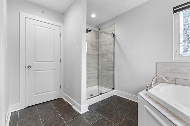 bathroom featuring tile patterned floors and plus walk in shower