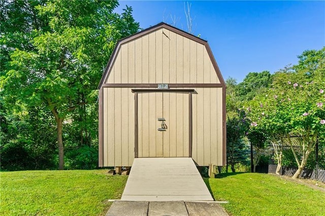 view of outbuilding featuring a yard