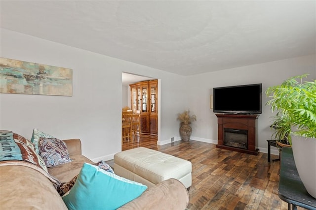 living room with dark hardwood / wood-style floors