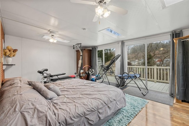 bedroom featuring ceiling fan, access to outside, and light wood-type flooring