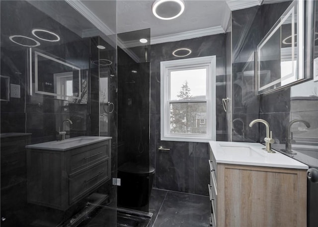 bathroom featuring crown molding, vanity, and tile walls