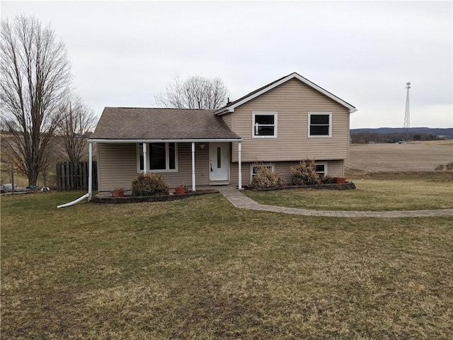 tri-level home with a front lawn