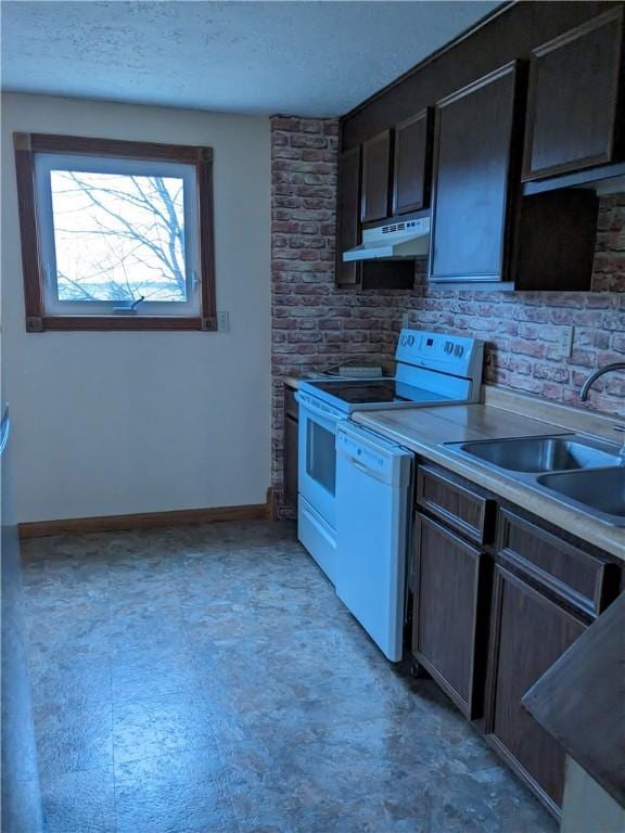 kitchen featuring dishwasher, sink, electric range oven, and a textured ceiling