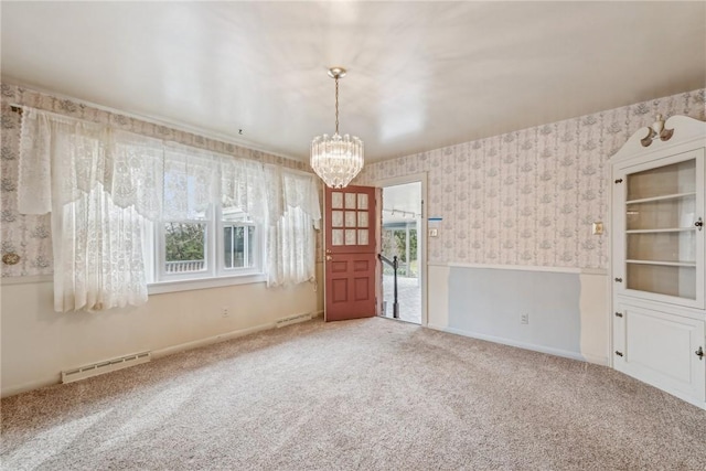 unfurnished room with a notable chandelier and carpet