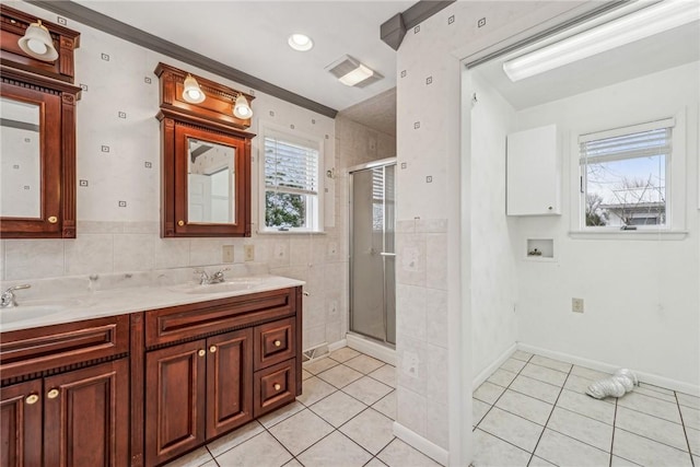 bathroom with tile patterned flooring, plenty of natural light, and walk in shower