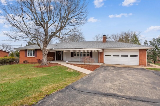 ranch-style house with a garage and a front yard