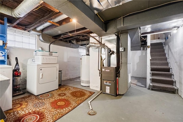 basement featuring water heater, separate washer and dryer, and heating unit