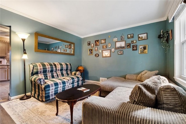 living room with wood-type flooring and ornamental molding