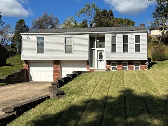 bi-level home featuring a garage and a front yard