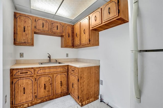 kitchen with white refrigerator and sink