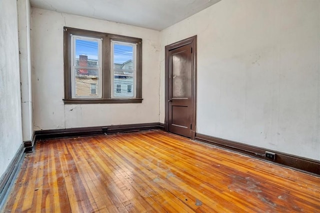 spare room featuring light hardwood / wood-style floors