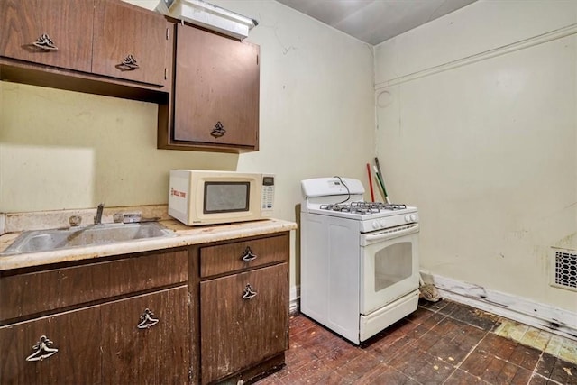 kitchen with sink and white appliances