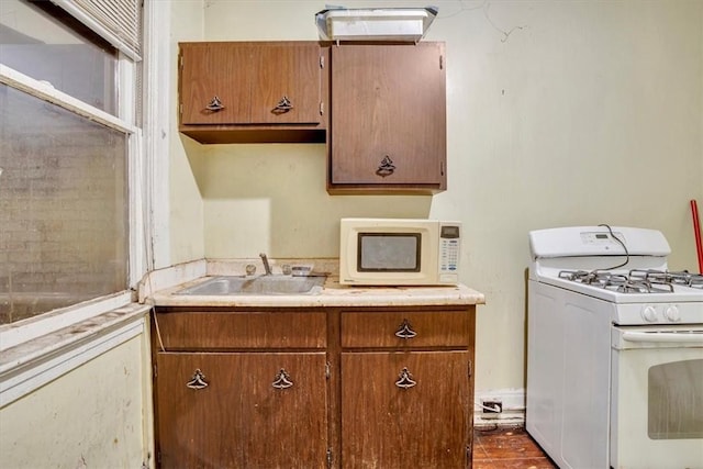 kitchen with white appliances and sink