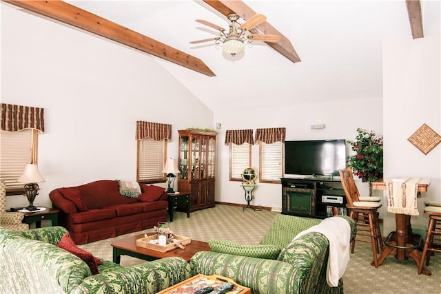 carpeted living room with beamed ceiling, ceiling fan, and high vaulted ceiling