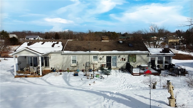 view of snow covered house