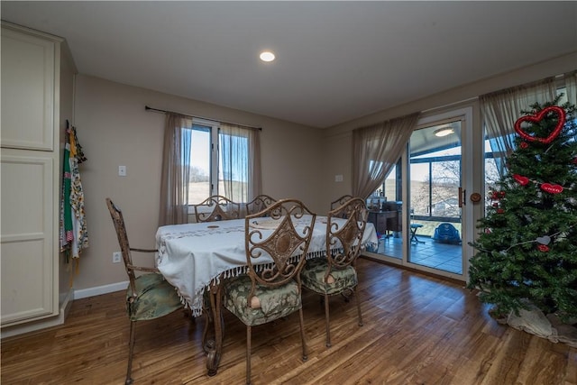 dining area with hardwood / wood-style floors