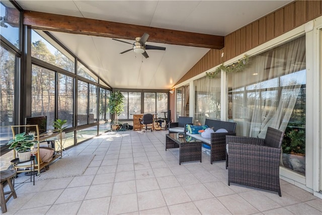 sunroom with ceiling fan and lofted ceiling with beams