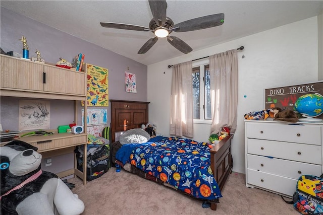 bedroom with light carpet and ceiling fan