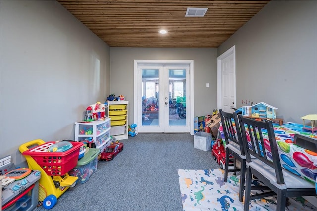 game room featuring carpet floors, wooden ceiling, and french doors