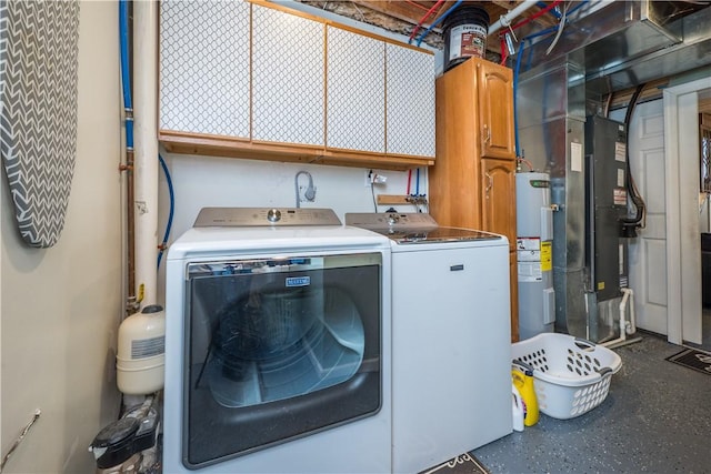 washroom with cabinets, independent washer and dryer, electric water heater, and heating unit