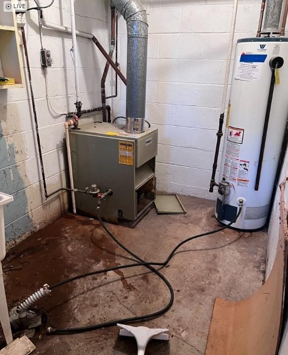 utility room featuring gas water heater