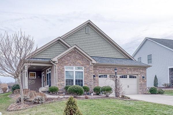 view of front of property featuring a garage and a front yard