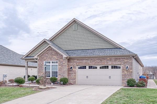 view of front of property with a garage and a front yard