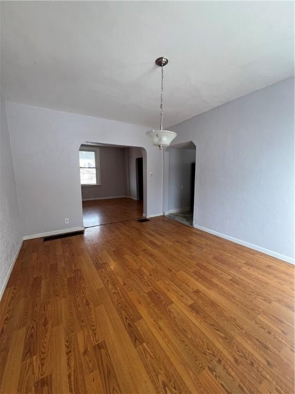 empty room featuring hardwood / wood-style flooring