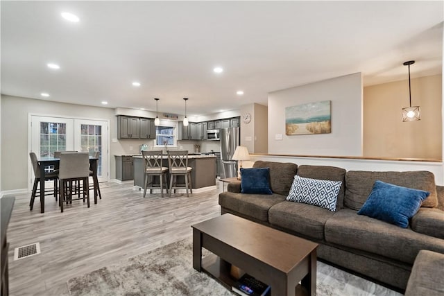 living room with light hardwood / wood-style floors