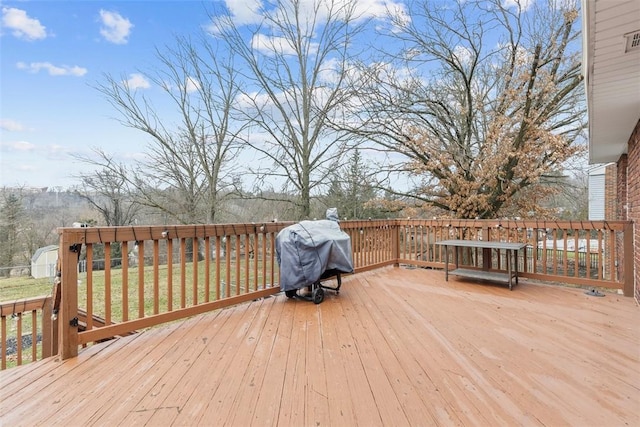 wooden deck with area for grilling