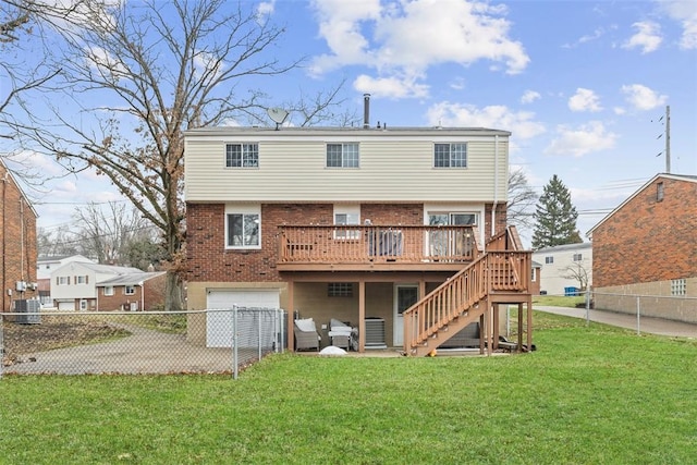 rear view of property with a wooden deck, a garage, a yard, and central air condition unit