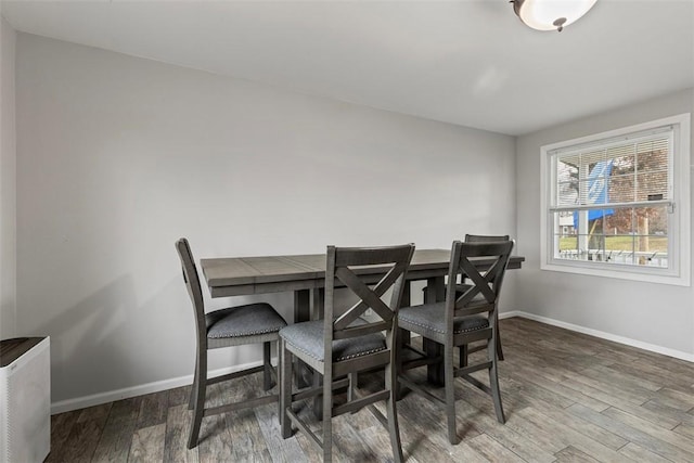 dining area with wood-type flooring