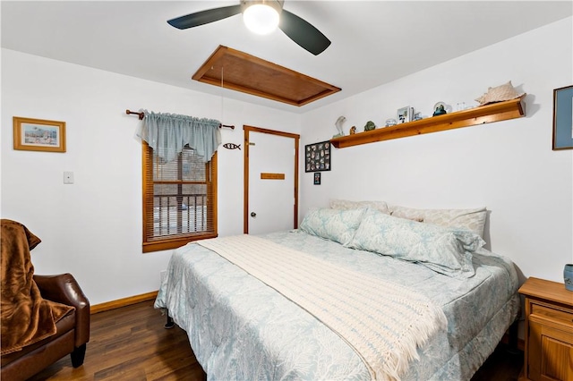 bedroom with dark wood-type flooring and ceiling fan