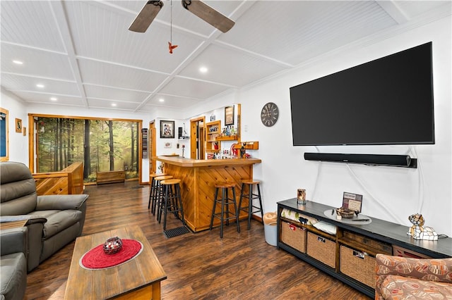 living room featuring ceiling fan, coffered ceiling, bar area, and dark hardwood / wood-style floors