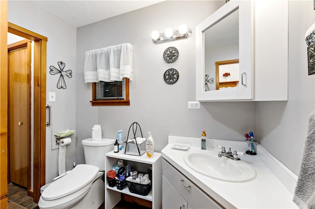 bathroom with vanity and toilet