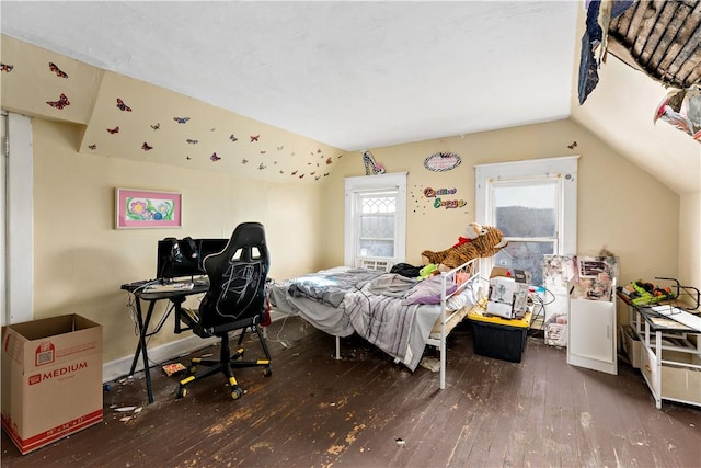 bedroom with vaulted ceiling and dark hardwood / wood-style floors