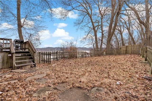 view of yard featuring a wooden deck