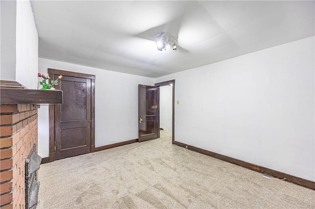 interior space featuring a fireplace and carpet floors