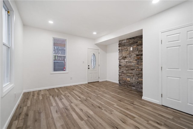 entrance foyer with light hardwood / wood-style flooring