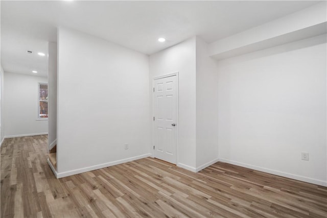 spare room with hardwood / wood-style flooring