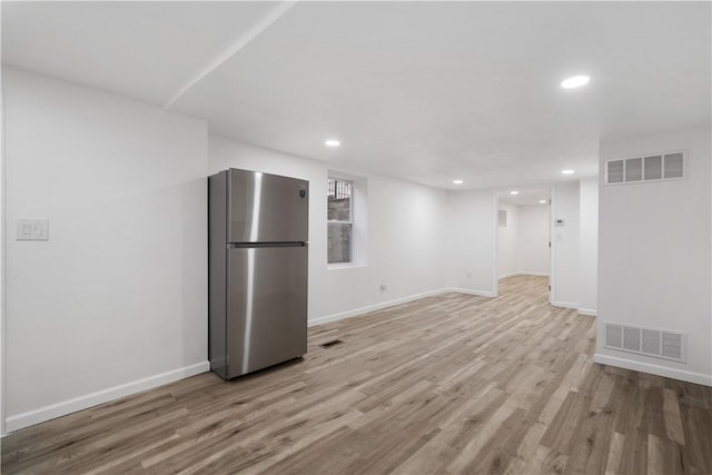 unfurnished living room with light hardwood / wood-style flooring