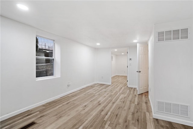 unfurnished room featuring light hardwood / wood-style floors