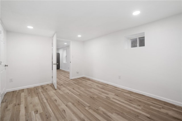 spare room featuring light hardwood / wood-style flooring