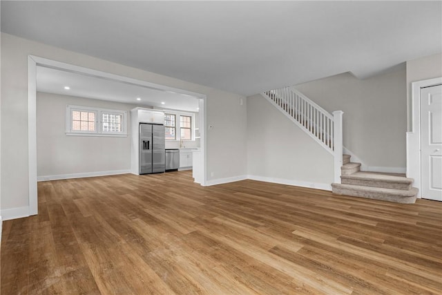 unfurnished living room with light hardwood / wood-style floors